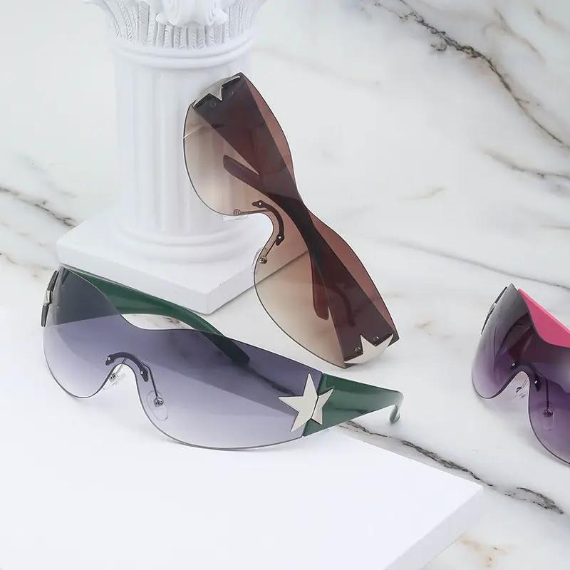 Rimless sunglasses set, 3 pairs with gradient lenses and star-embellished temples in purple, green, brown tones.