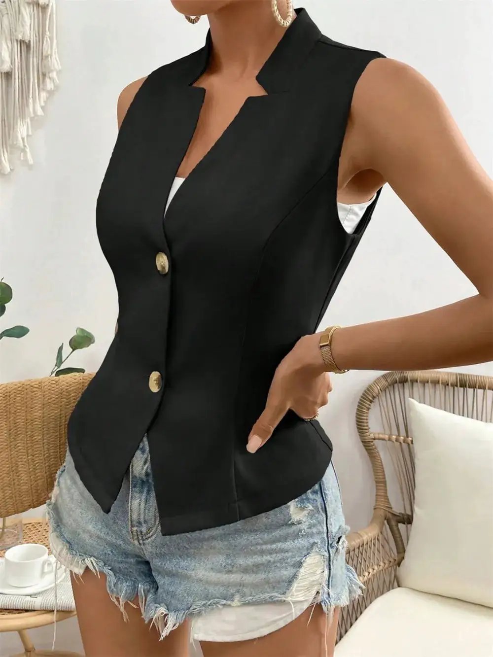 Button Down Vest Coat by eprolo; black sleeveless tailored vest with gold buttons.