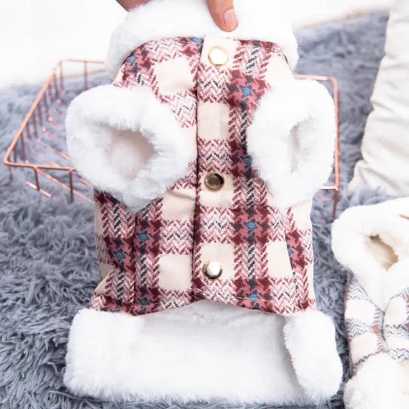 Dog vest with pink plaid fabric and white plush fur trim, snap button closures