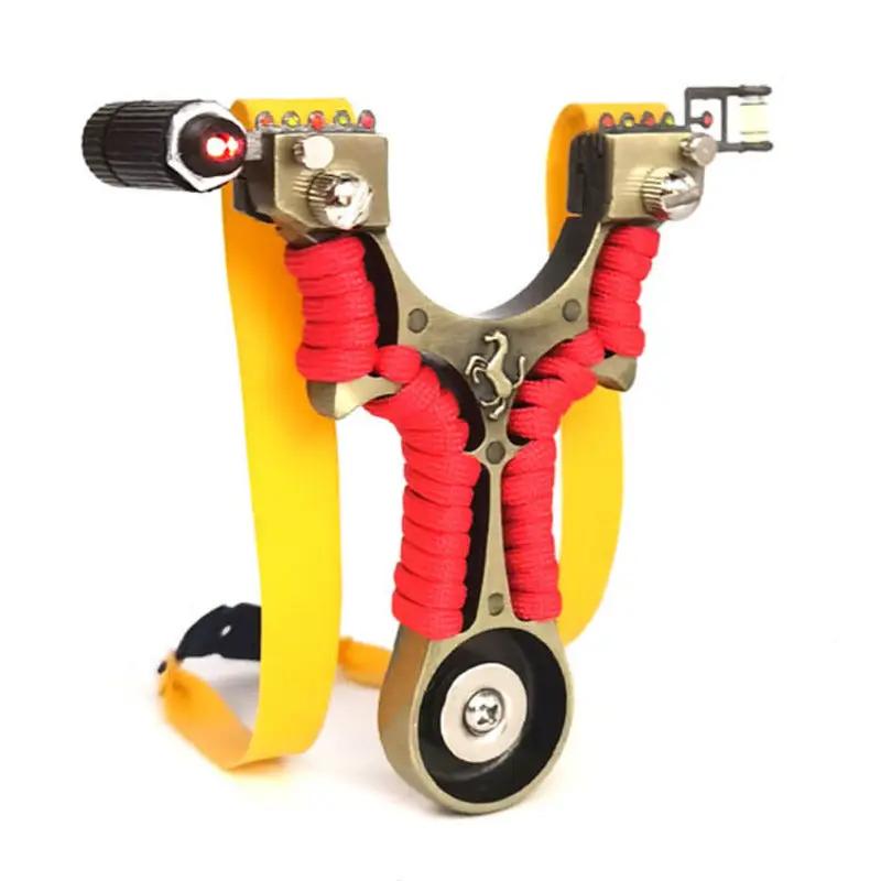 Metal flat skin slingshot by eprolo with red paracord grip, yellow elastic bands and laser sight accessory