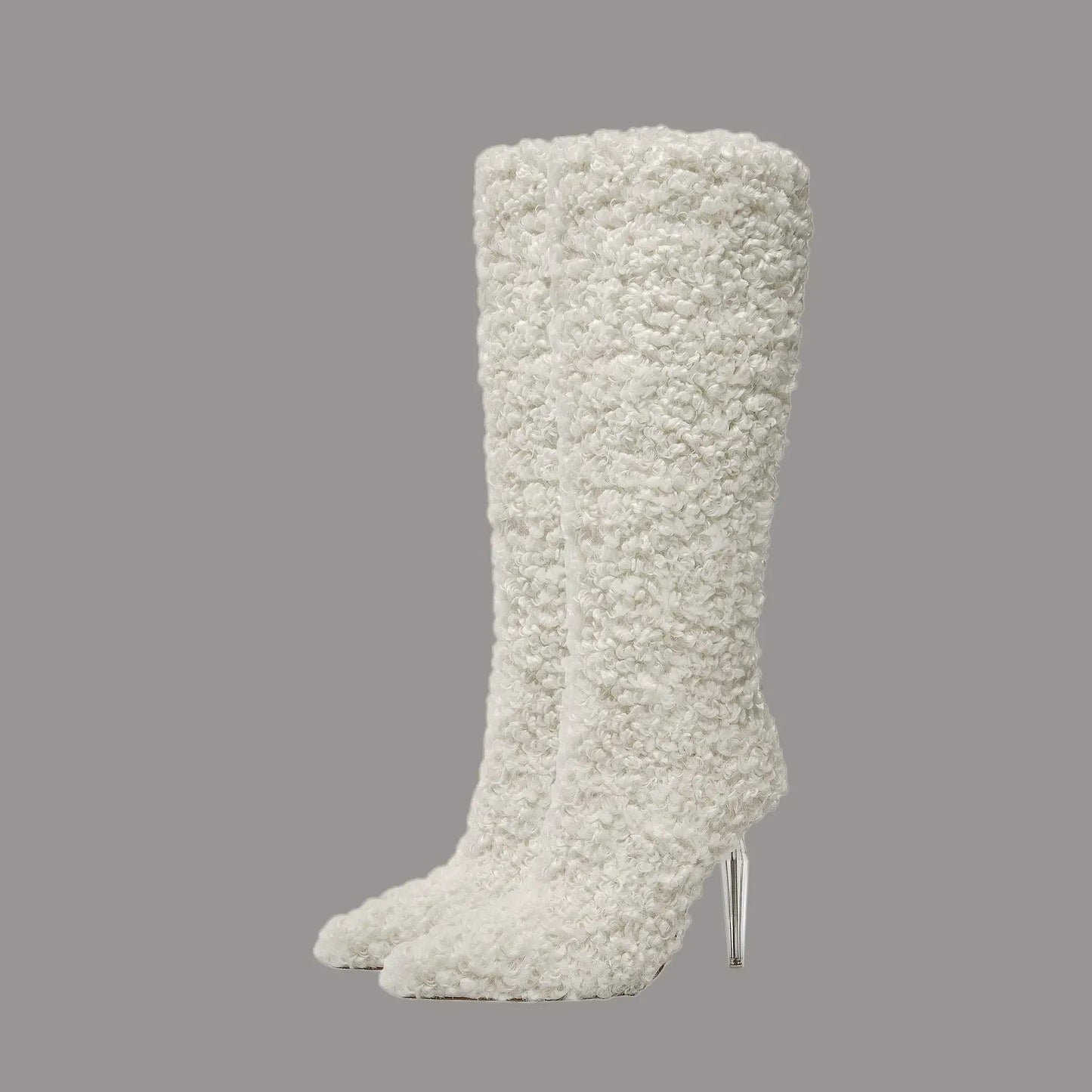 Two white boucle knee-high boots with pointed toes and high stiletto heels on display