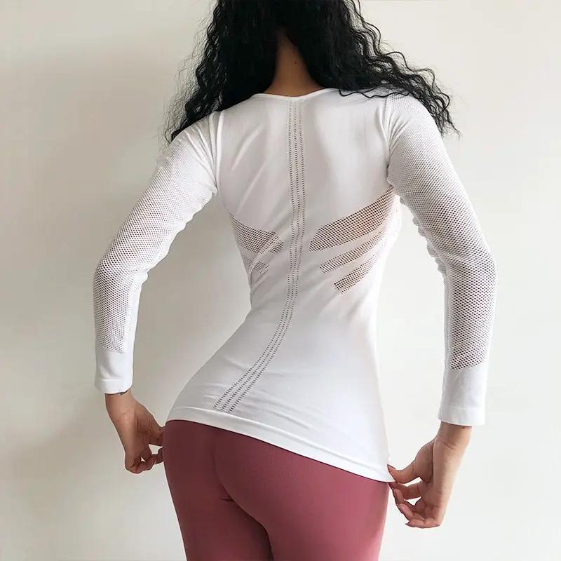 Women's white long-sleeve mesh fitness top with back panels and sleeve mesh
