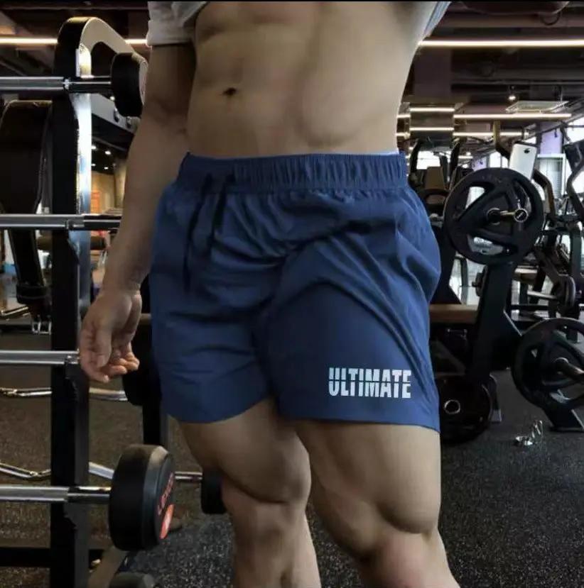 Men's blue quick-dry gym shorts by eprolo with ULTIMATE logo for training