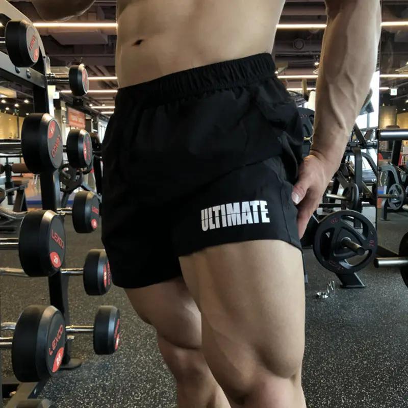 Men's black quick-dry gym shorts, three-quarter length, elastic waistband, ULTIMATE print