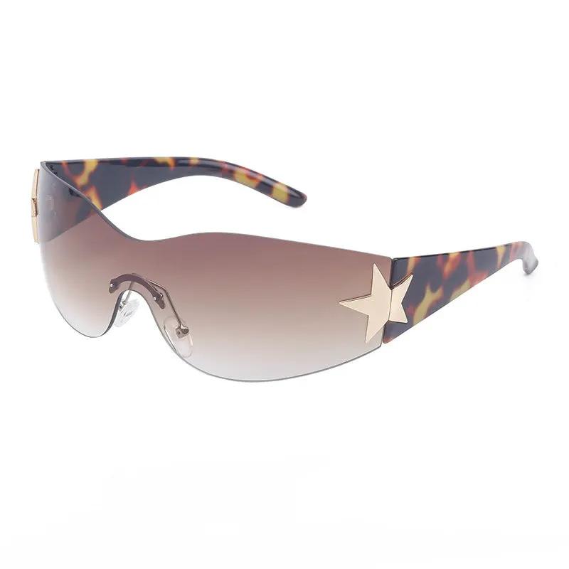 Retro rimless sunglasses with tortoiseshell arms, gradient lenses, and a gold star accent