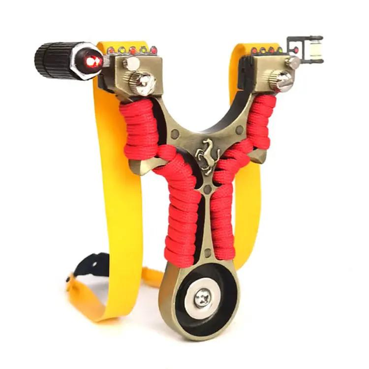 eprolo metal Y-shaped slingshot with red paracord wraps and yellow wrist strap, laser sight left and scope right