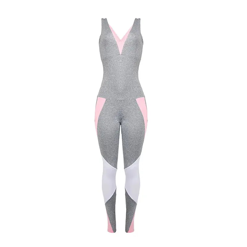 Women's gym jumpsuit with grey speckled fabric, pink side panels and white leg panels, pink V-neck accent