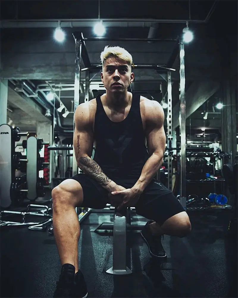 Summer bodybuilding stringer tank top for men, black mesh gym undershirt.
