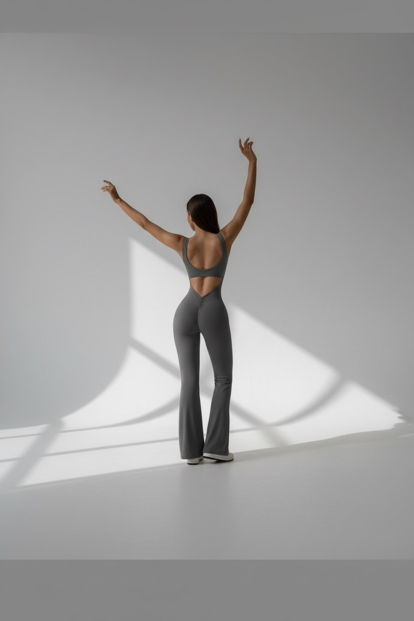 Backless flare yoga bodysuit unitard in gray with open-back design.